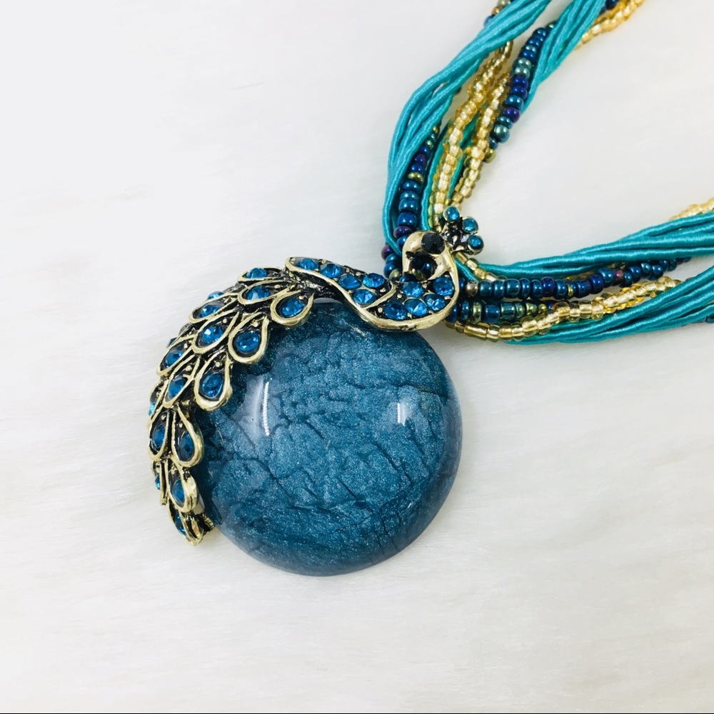 Only ships with $15 orders. Blue Peacock Necklace